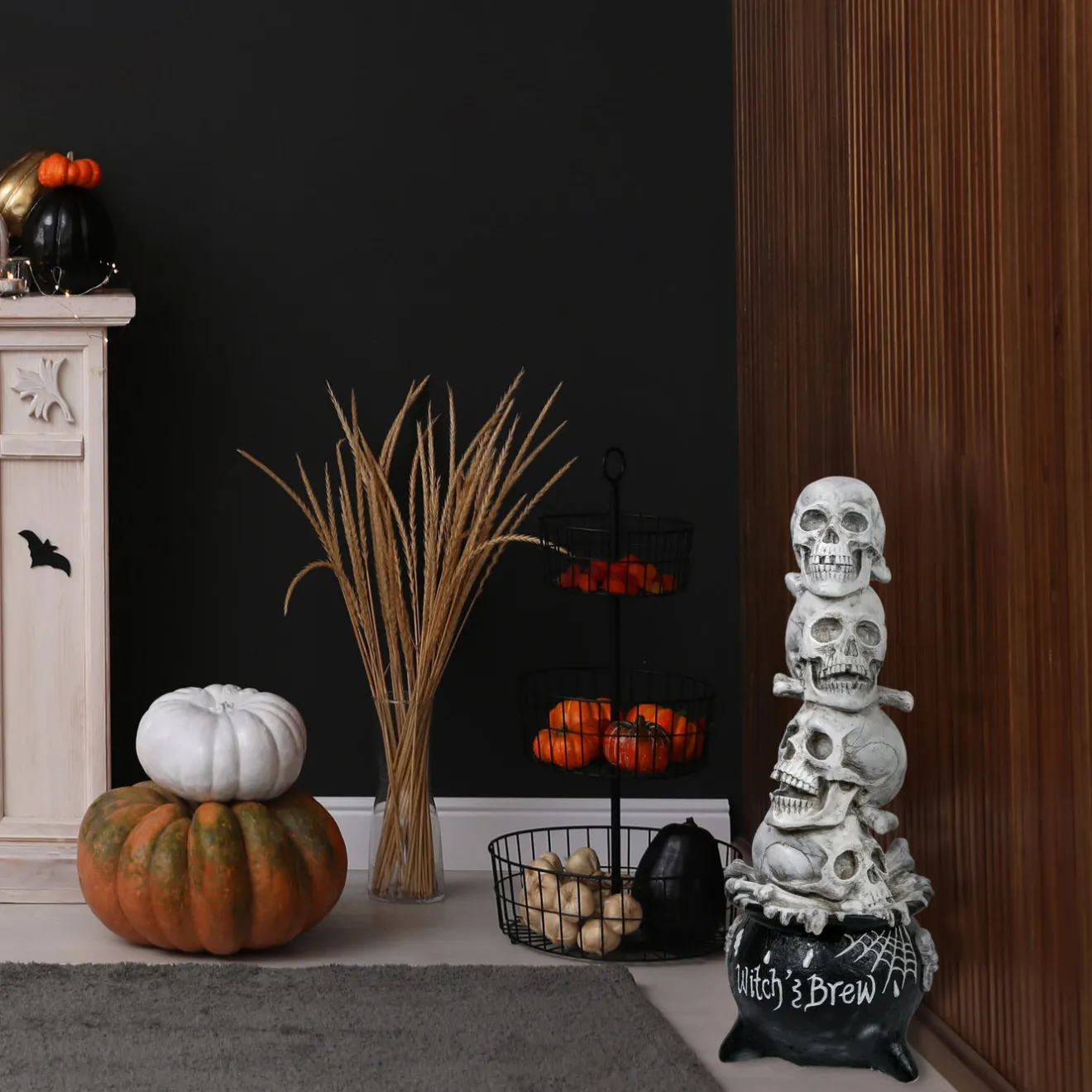 38 in. Halloween Stacked Skulls in a Cauldron Tabletop Decoration Indoor Decorations